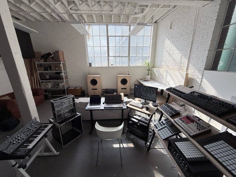 The whole room from above: roof trusses, the modular, the desks and the tiered instrument stand.